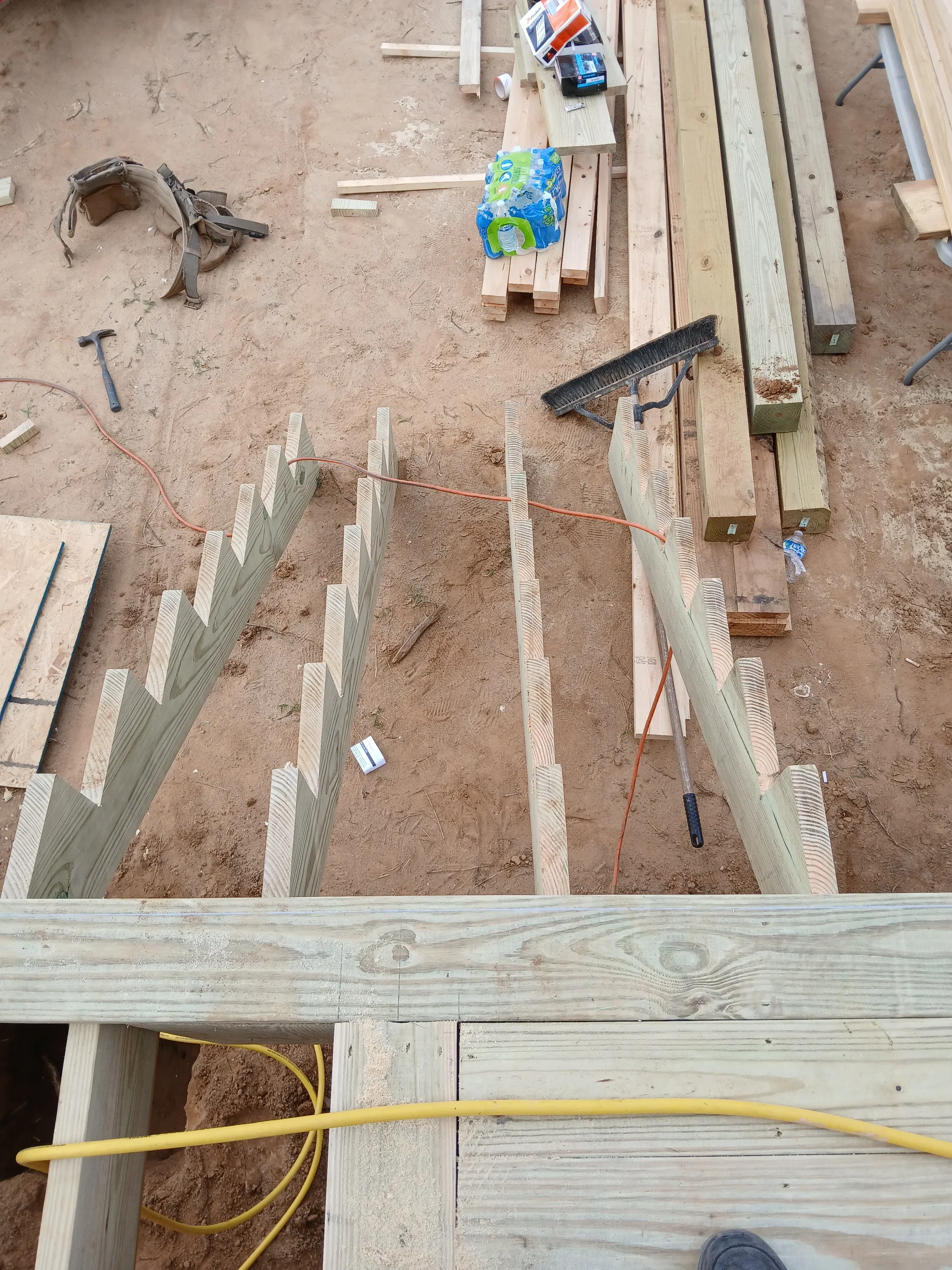 Lumber framing with electrical conduit and wiring on construction site
