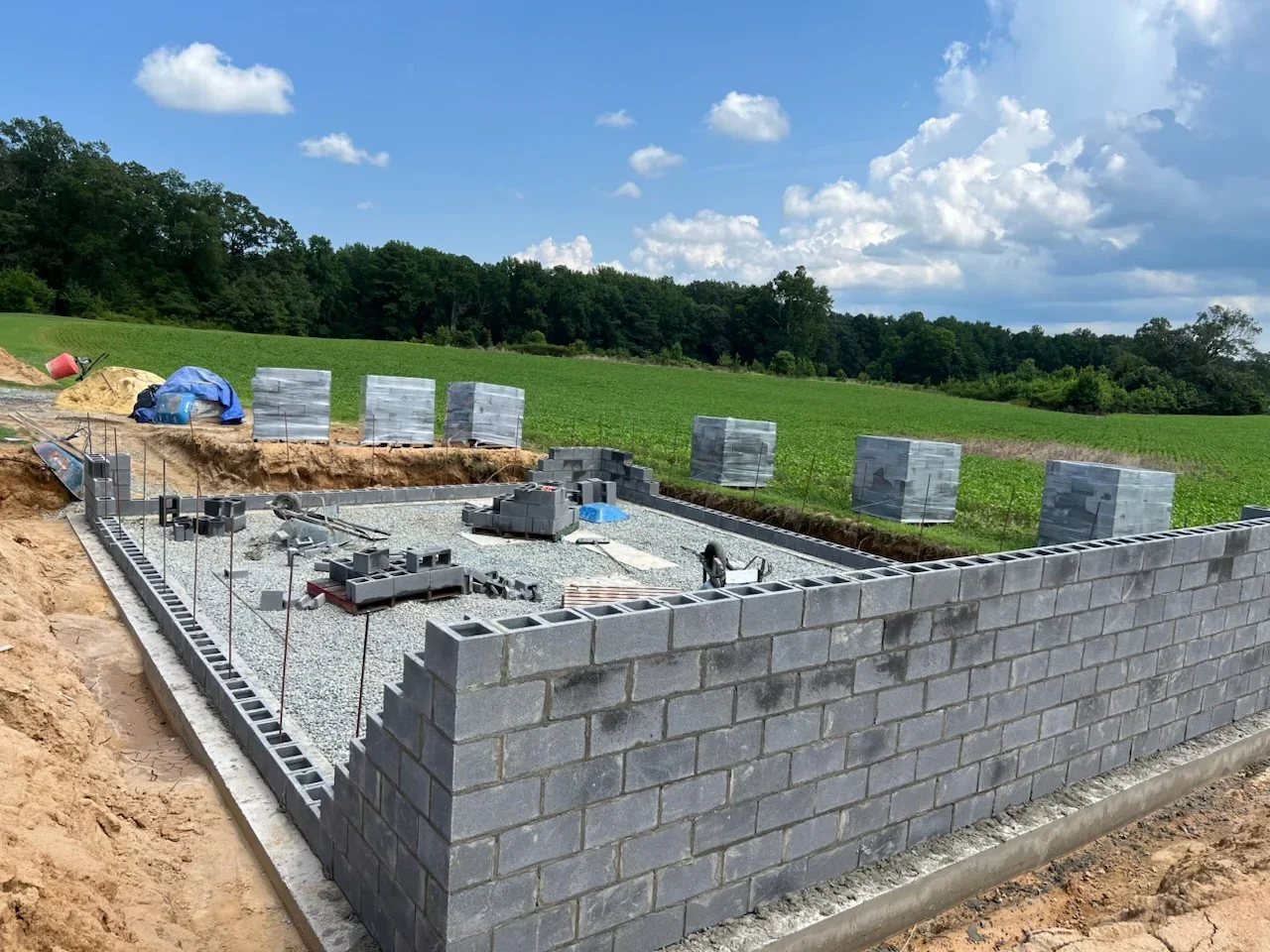 Concrete block foundation walls with gravel base and drainage system during residential construction