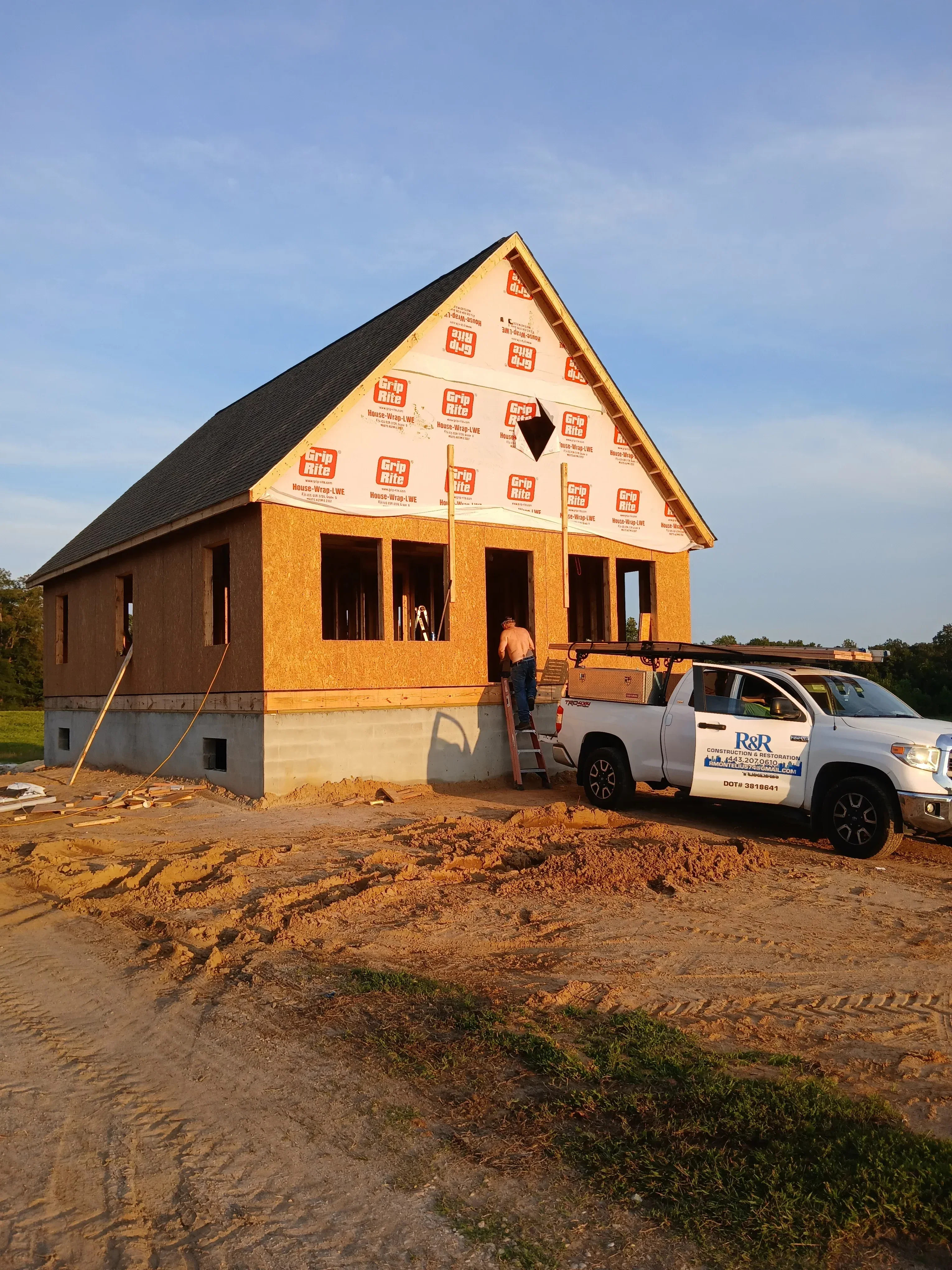 Roof decking and synthetic underlayment installation on residential home framing