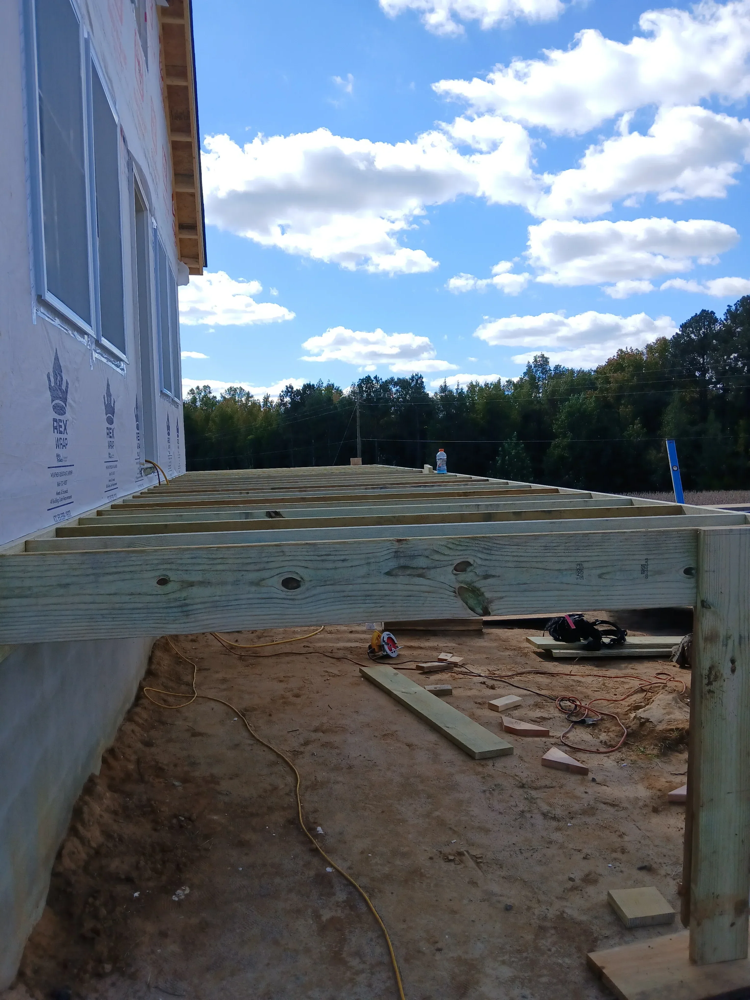 Foundation wall repair with new treated lumber framing and structural bracing installation